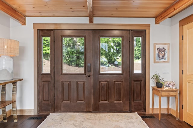 134 Zakelo Rd, Harrison, ME 04040 - foyer entrance with wood ceiling with exposed beams, dark wood-style flooring, and baseboards