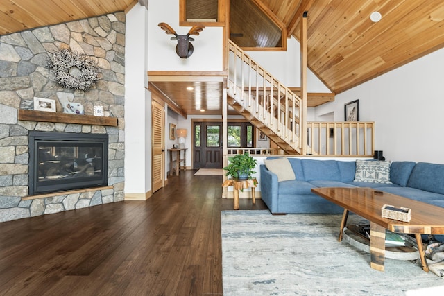 134 Zakelo Rd, Harrison, ME 04040 - living area featuring stairway, wooden ceiling, hardwood / wood-style floors, high vaulted ceiling, and a stone fireplace