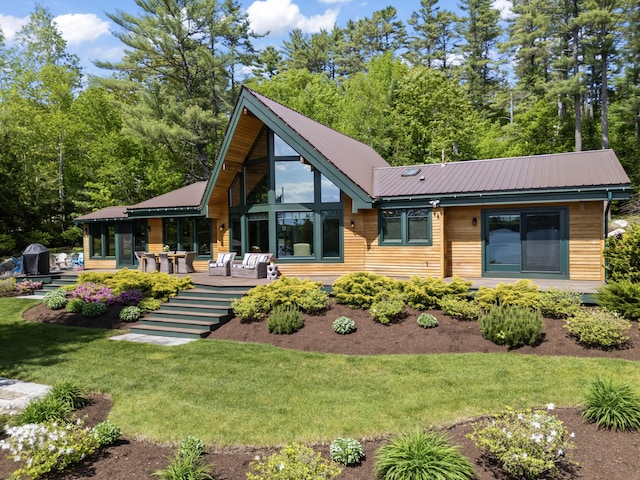 134 Zakelo Rd, Harrison, ME 04040 - rear view of property featuring a lawn and metal roof