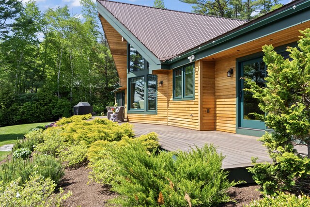 134 Zakelo Rd, Harrison, ME 04040 - doorway to property with a wooden deck and metal roof