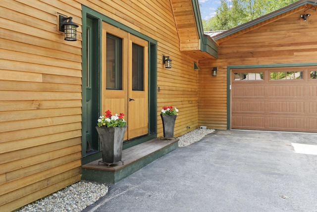 134 Zakelo Rd, Harrison, ME 04040 - doorway to property with an attached garage and driveway
