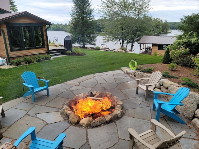 134 Zakelo Rd, Harrison, ME 04040 - view of patio with an outdoor fire pit and a water view