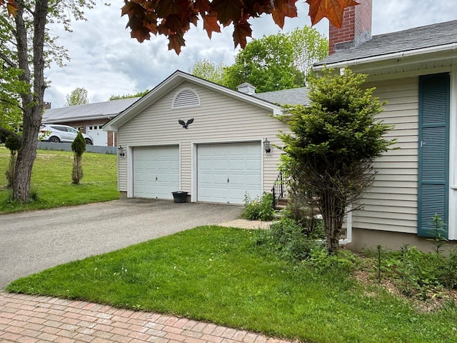 16 Steamboat St, Calais, ME 04619 - garage featuring asphalt driveway