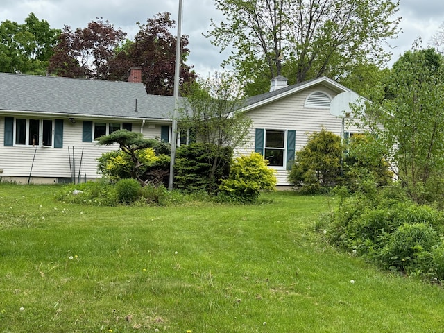 16 Steamboat St, Calais, ME 04619 - rear view of house featuring a chimney and a yard