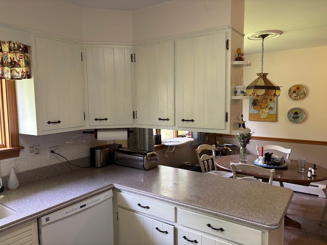 16 Steamboat St, Calais, ME 04619 - kitchen with dishwasher, white cabinetry, and decorative backsplash