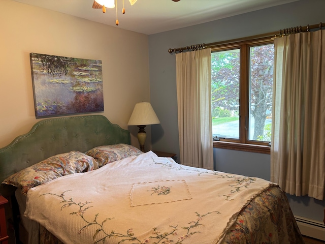 16 Steamboat St, Calais, ME 04619 - bedroom with a baseboard heating unit and multiple windows