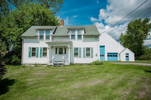 31 Village St, Jefferson, ME 04348 - view of front of home with a chimney, a garage, roof with shingles, and a front yard