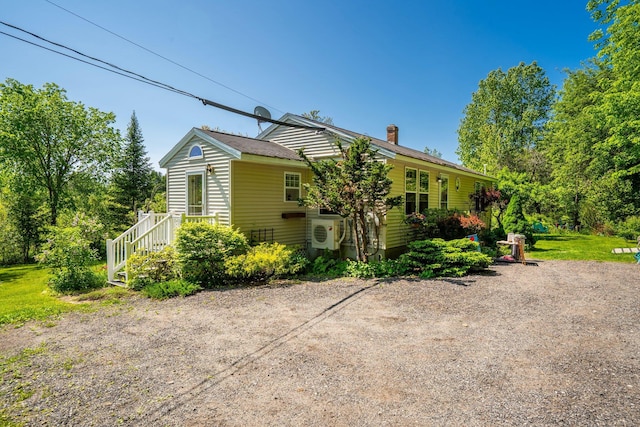 129 Lawrence Rd, Gray, ME 04039 - view of home's exterior with a chimney and ac unit