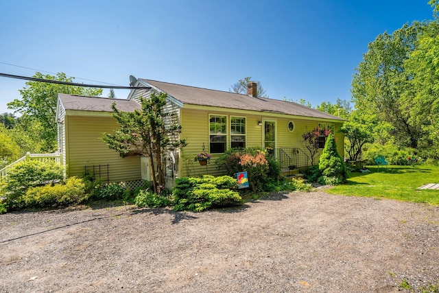129 Lawrence Rd, Gray, ME 04039 - view of front facade with a chimney and a front lawn