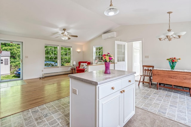 129 Lawrence Rd, Gray, ME 04039 - kitchen featuring a wall mounted air conditioner, a chandelier, lofted ceiling, a baseboard heating unit, and ceiling fan