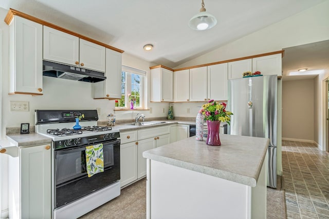 129 Lawrence Rd, Gray, ME 04039 - kitchen featuring range with gas cooktop, under cabinet range hood, a sink, freestanding refrigerator, and lofted ceiling