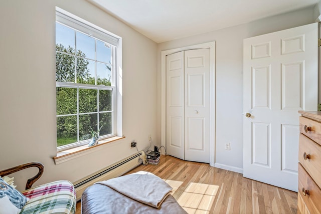 129 Lawrence Rd, Gray, ME 04039 - bedroom featuring baseboard heating, multiple windows, light wood finished floors, and a closet