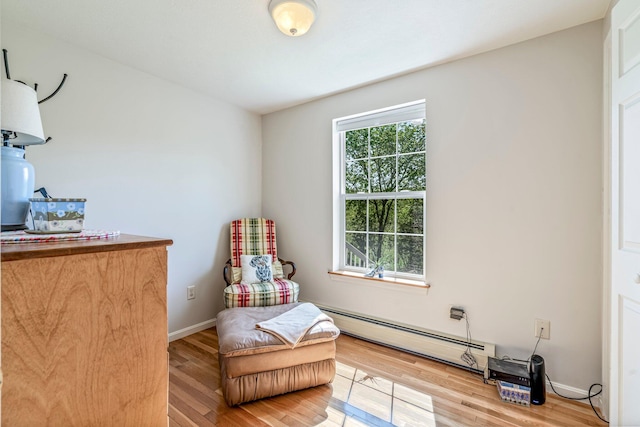 129 Lawrence Rd, Gray, ME 04039 - sitting room with a baseboard heating unit, wood finished floors, and baseboards
