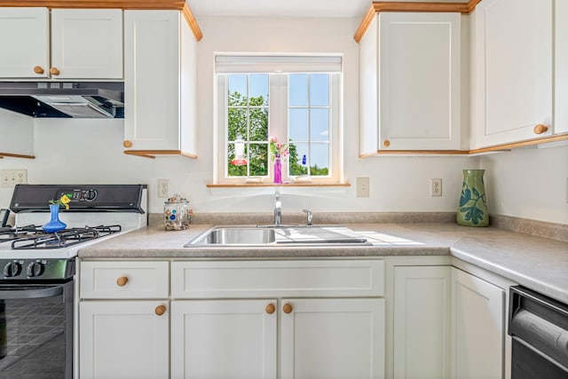 129 Lawrence Rd, Gray, ME 04039 - kitchen featuring gas stove, under cabinet range hood, light countertops, a sink, and white cabinetry