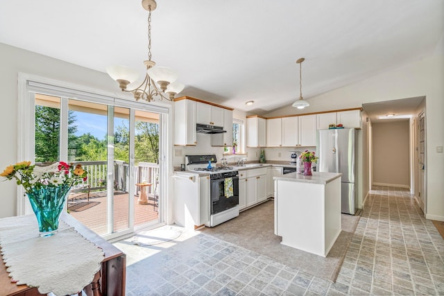 129 Lawrence Rd, Gray, ME 04039 - kitchen with white gas range, freestanding refrigerator, a sink, under cabinet range hood, and a chandelier