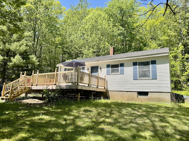 323 Main St S, Searsmont, ME 04973 - rear view of house with a lawn, a deck, and a chimney