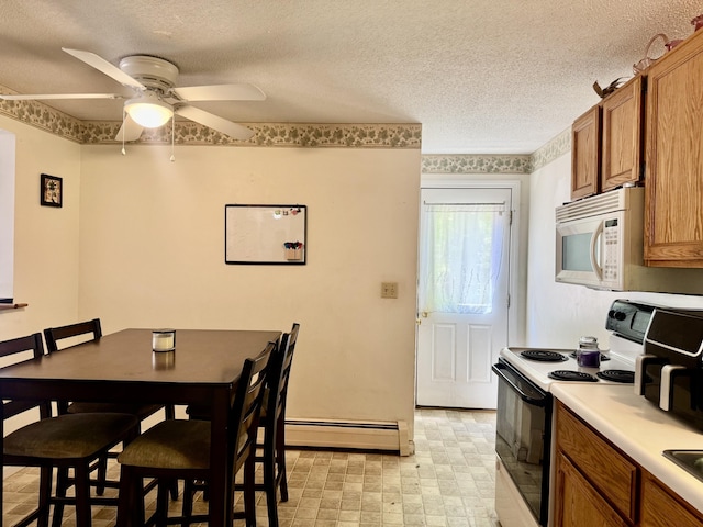 323 Main St S, Searsmont, ME 04973 - dining space featuring baseboard heating, ceiling fan, and a textured ceiling