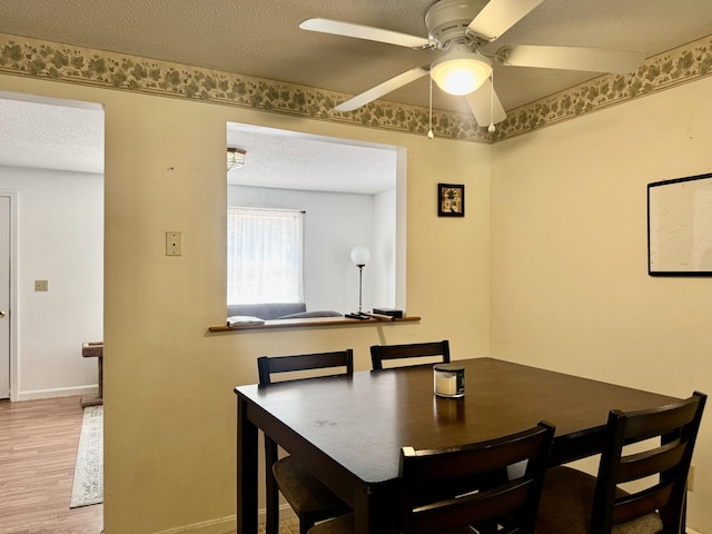 323 Main St S, Searsmont, ME 04973 - dining space with ceiling fan, wood finished floors, a textured ceiling, and baseboards