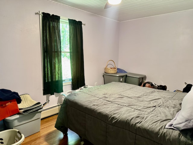 323 Main St S, Searsmont, ME 04973 - bedroom with wood finished floors and a baseboard radiator