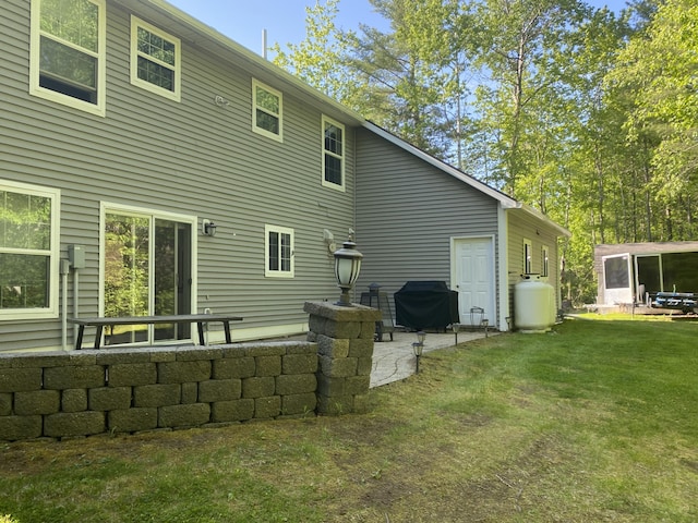 12 Cromwell Dr, Orono, ME 04473 - back of house featuring a lawn