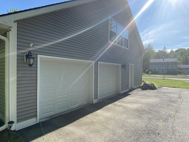 12 Cromwell Dr, Orono, ME 04473 - garage with asphalt driveway