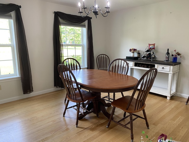 12 Cromwell Dr, Orono, ME 04473 - dining room with a chandelier, light wood-type flooring, and plenty of natural light