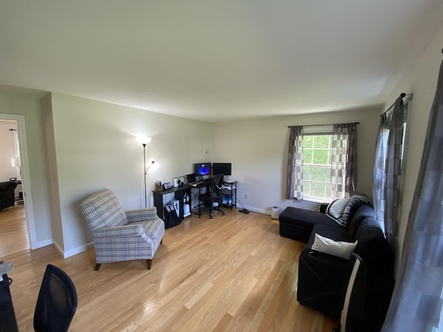 12 Cromwell Dr, Orono, ME 04473 - living room with light wood-style flooring and a desk