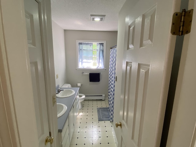 12 Cromwell Dr, Orono, ME 04473 - bathroom with baseboard heating, a textured ceiling, double vanity, and curtained shower