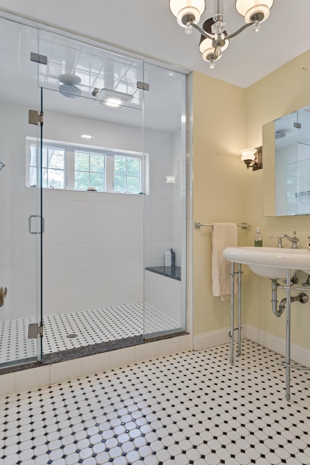 496 Coles Hill Rd, Wells, ME 04090 - bathroom featuring a stall shower, a chandelier, and tile patterned flooring