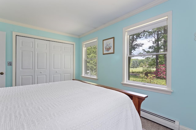 496 Coles Hill Rd, Wells, ME 04090 - bedroom with a baseboard radiator, multiple windows, ornamental molding, a closet, and carpet flooring