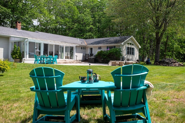 496 Coles Hill Rd, Wells, ME 04090 - rear view of house with a yard and a patio