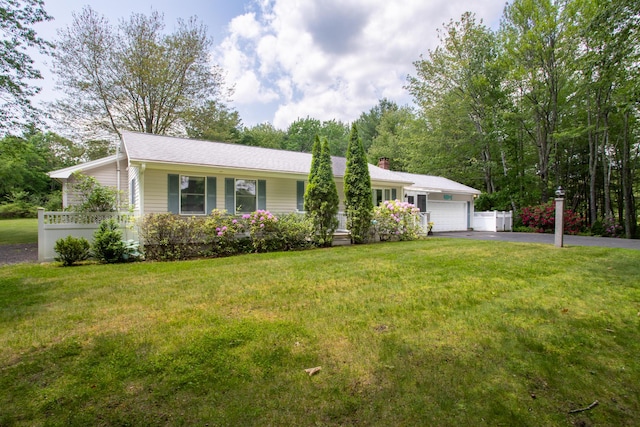 496 Coles Hill Rd, Wells, ME 04090 - ranch-style house featuring driveway, an attached garage, and a front lawn