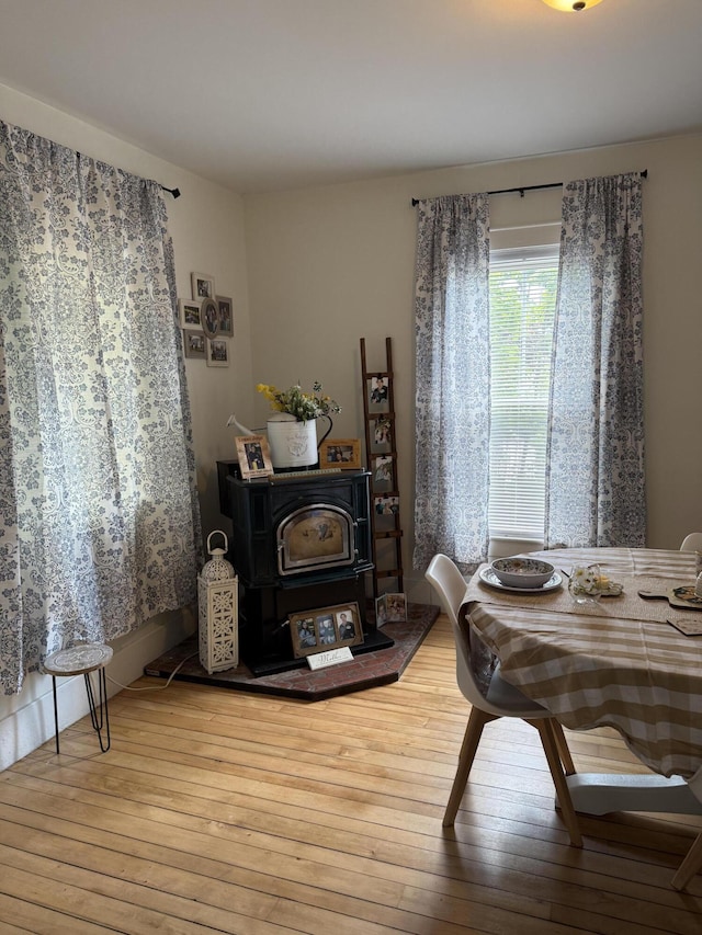 5 Columbia St, Augusta, ME 04330 - dining space featuring a wood stove and hardwood / wood-style flooring