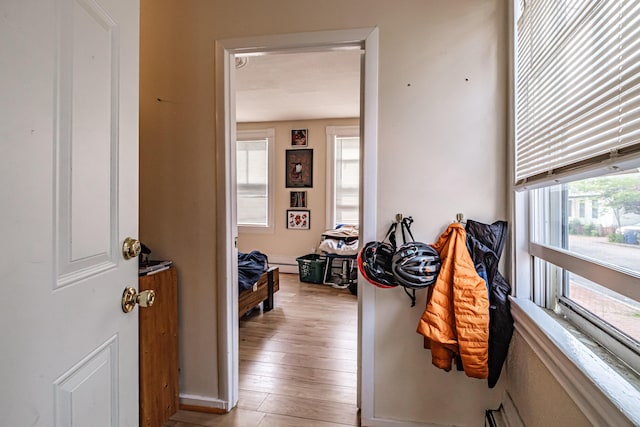 83 Brackett St, Portland, ME 04102 - corridor with wood finished floors and baseboard heating