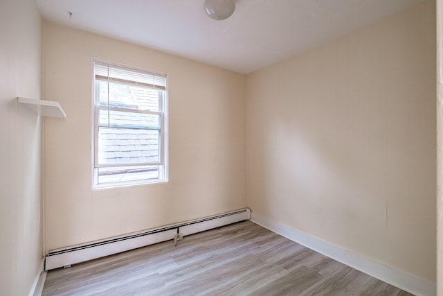 83 Brackett St, Portland, ME 04102 - empty room featuring baseboard heating and light wood-style flooring