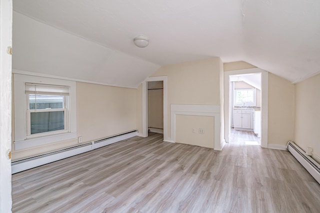 83 Brackett St, Portland, ME 04102 - bonus room with a baseboard heating unit, light wood-type flooring, and vaulted ceiling