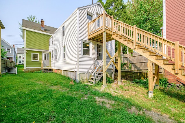 83 Brackett St, Portland, ME 04102 - view of side of home with entry steps, stairs, a lawn, and a wooden deck