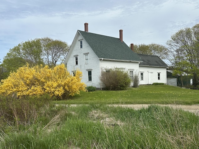 87 N Rd, Matinicus Isle Plt, ME 04851 - view of property exterior with a chimney, a shingled roof, and a yard