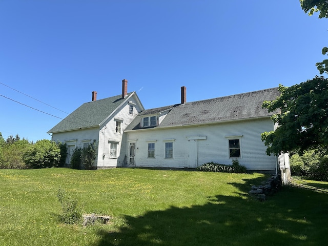 87 N Rd, Matinicus Isle Plt, ME 04851 - rear view of house featuring a yard and a chimney