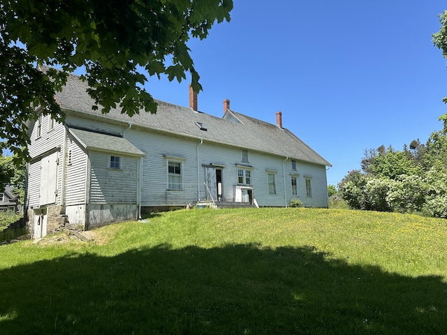 87 N Rd, Matinicus Isle Plt, ME 04851 - rear view of house featuring a lawn and a chimney