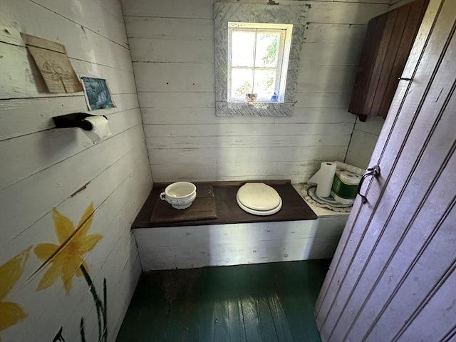 87 N Rd, Matinicus Isle Plt, ME 04851 - bathroom with hardwood / wood-style flooring and wood walls