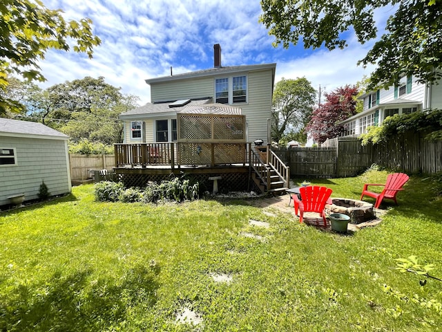 121 Bolton St, Portland, ME 04102 - rear view of house featuring a fire pit, a wooden deck, and a chimney