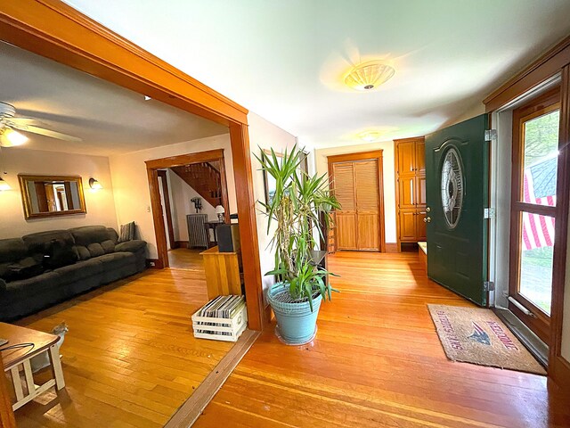 121 Bolton St, Portland, ME 04102 - entrance foyer with plenty of natural light, light wood-style floors, a ceiling fan, and radiator heating unit