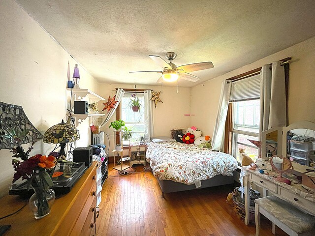 121 Bolton St, Portland, ME 04102 - bedroom featuring a textured ceiling, wood-type flooring, and ceiling fan