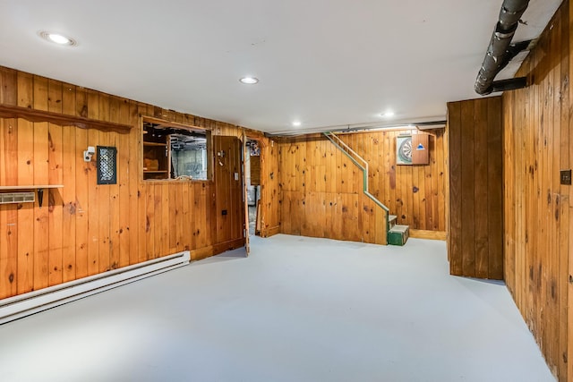 121 Bolton St, Portland, ME 04102 - finished basement featuring wooden walls, a baseboard heating unit, stairway, and recessed lighting