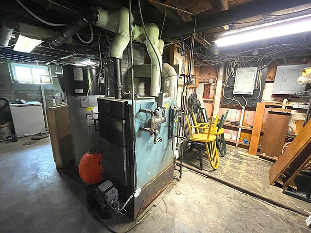 121 Bolton St, Portland, ME 04102 - utility room featuring electric panel and washer / dryer