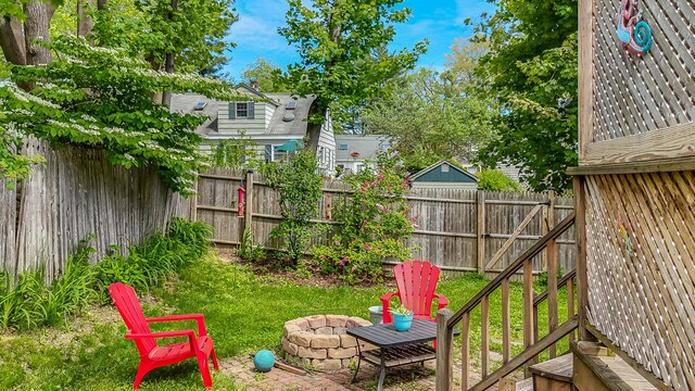 121 Bolton St, Portland, ME 04102 - fenced backyard with a fire pit