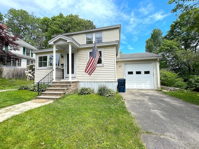 121 Bolton St, Portland, ME 04102 - view of front of home featuring asphalt driveway and an attached garage