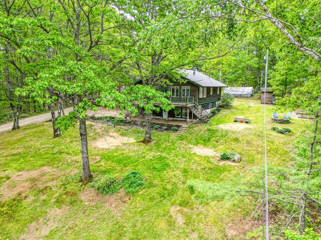 14 Greenleaf Ln, Monmouth, ME 04259 - view of yard with stairway, a wooden deck, and a wooded view
