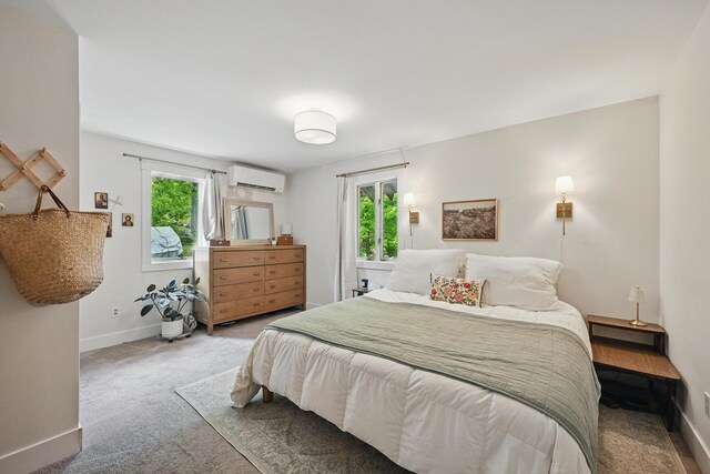 14 Greenleaf Ln, Monmouth, ME 04259 - bedroom featuring an AC wall unit, multiple windows, baseboards, and carpet floors